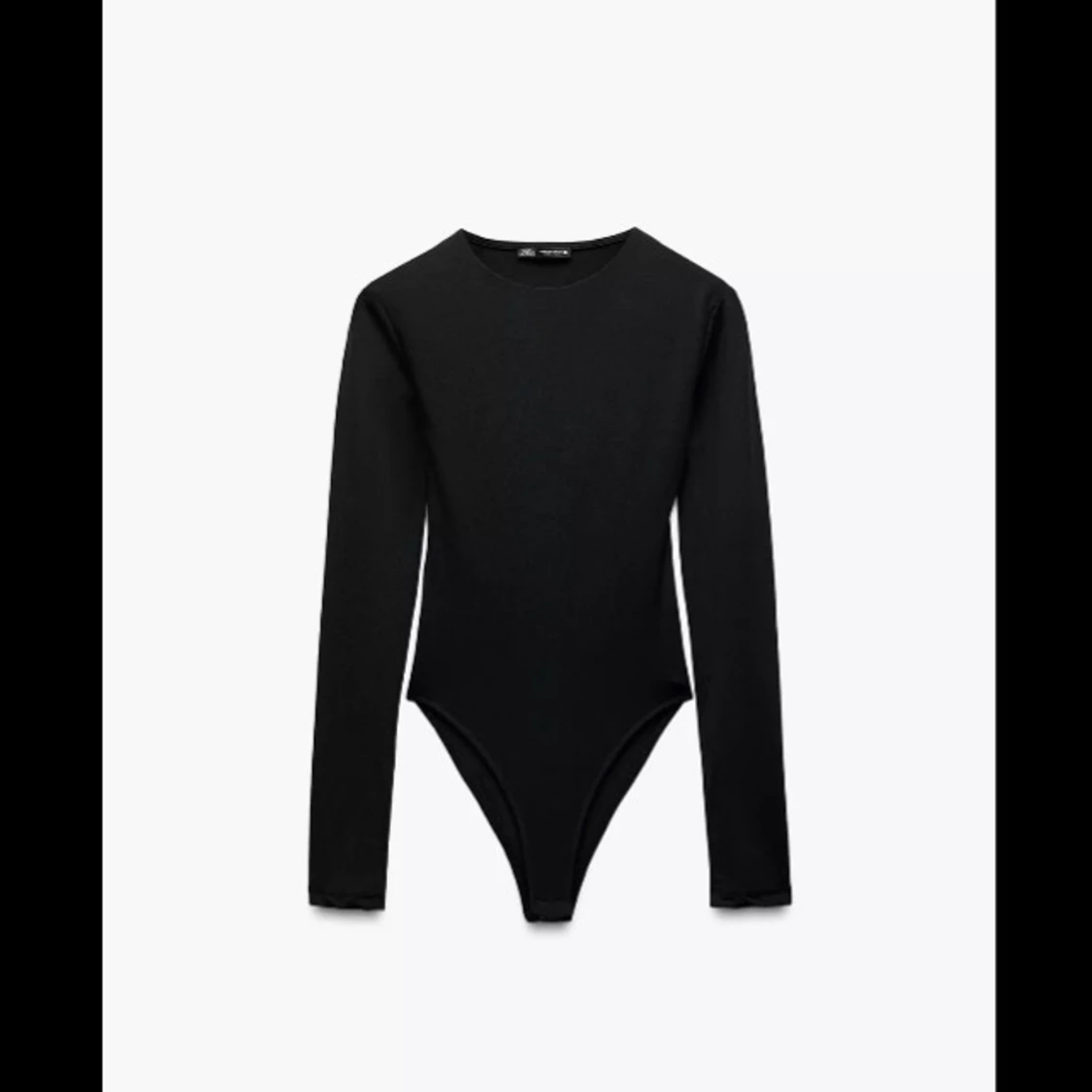 Svart långärmad body Zara