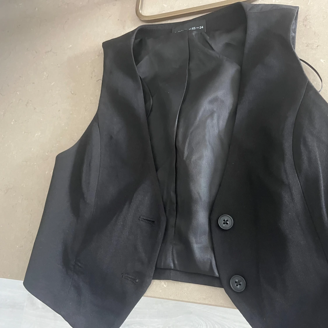 Svart kostymväst från Lefties i storlek XS