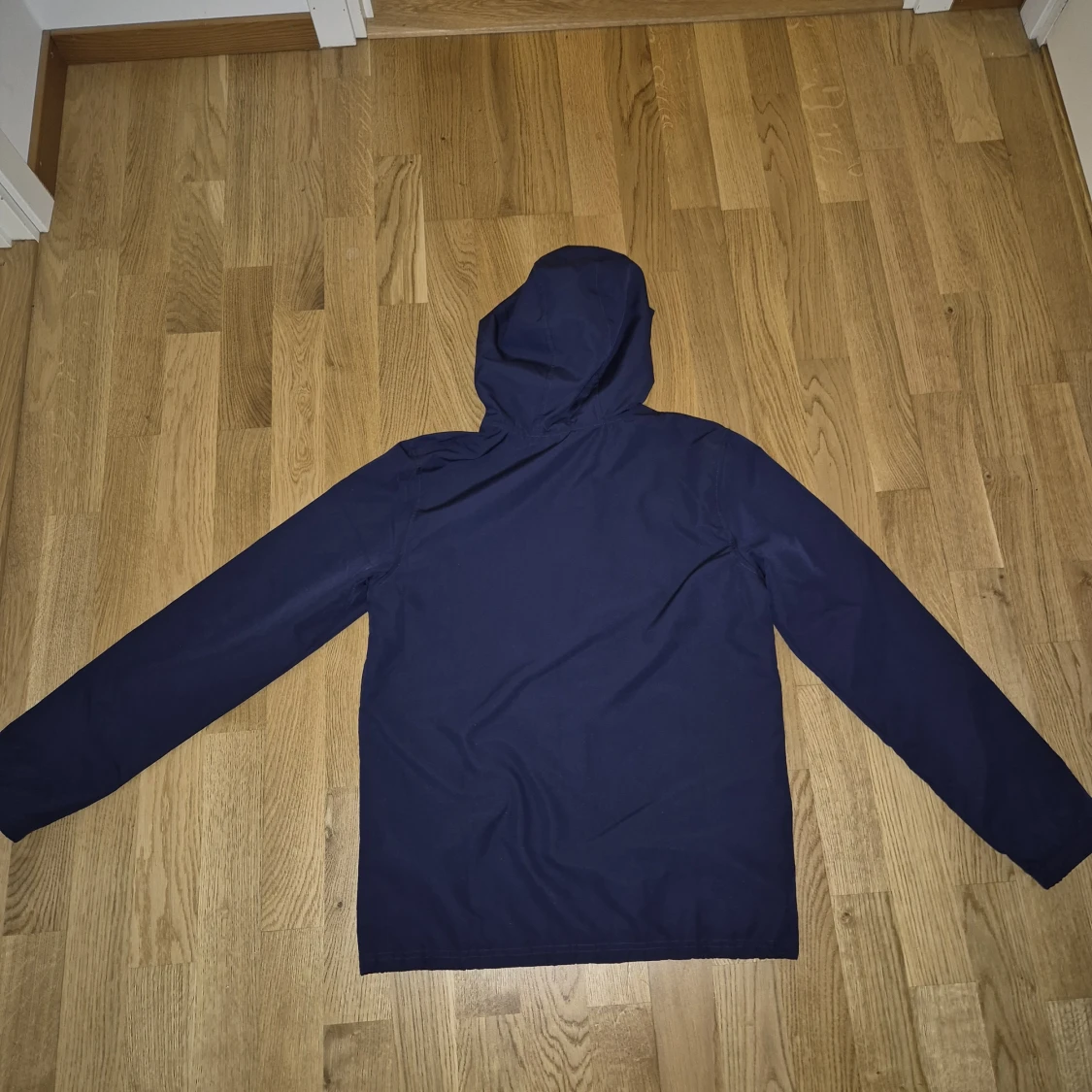 Blå vindjacka från Under Armour XS - S - 1