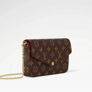 kuvertväska -  kuvertväska . Väskan är brun med guldiga detaljer och har en avtagbar guldfärgad kedja. Insidan är vinröd och väskan har flera fack och en matchande plånbok. Perfekt för dig som vill ha något lyxigt och stilrent.