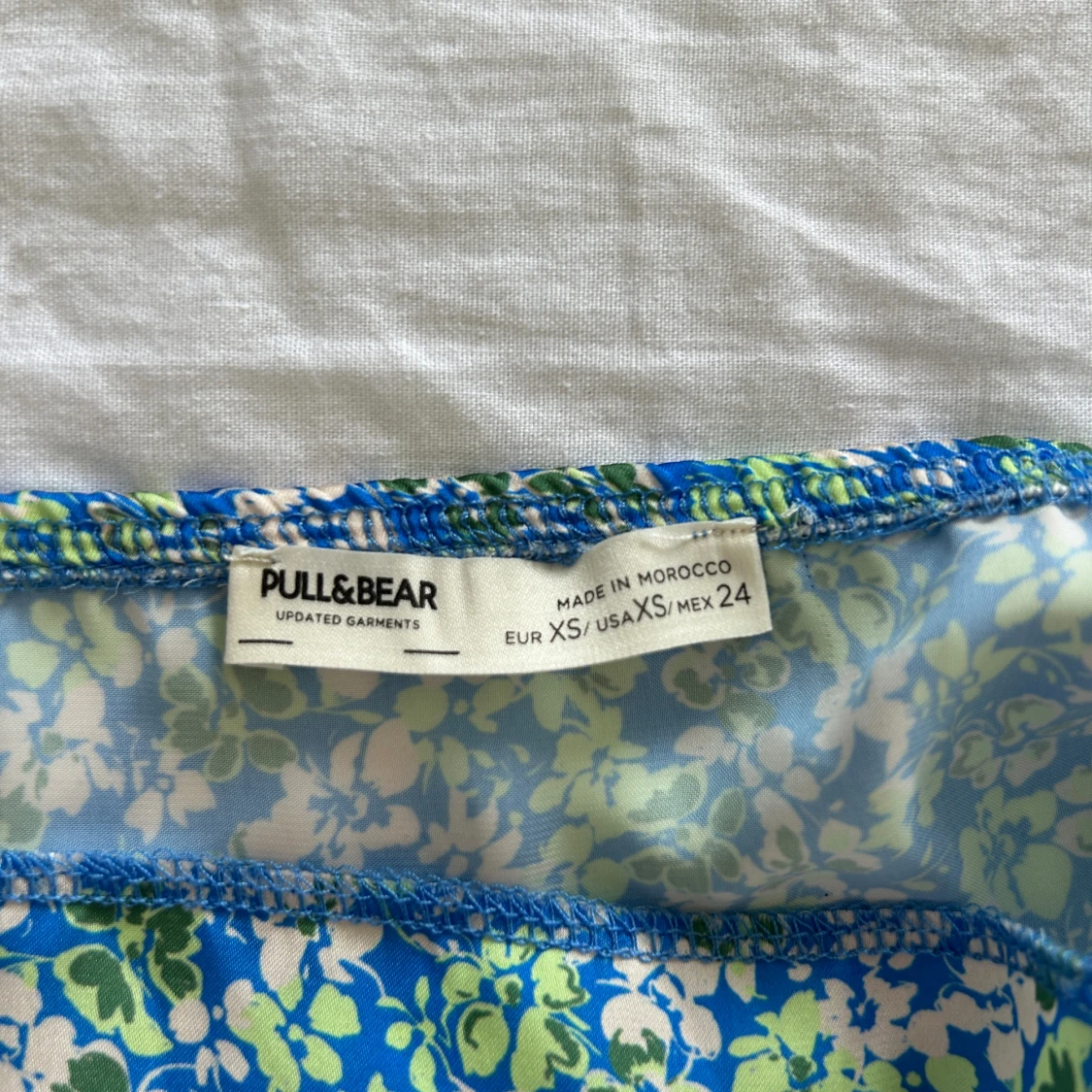 Blå blommig topp - 92