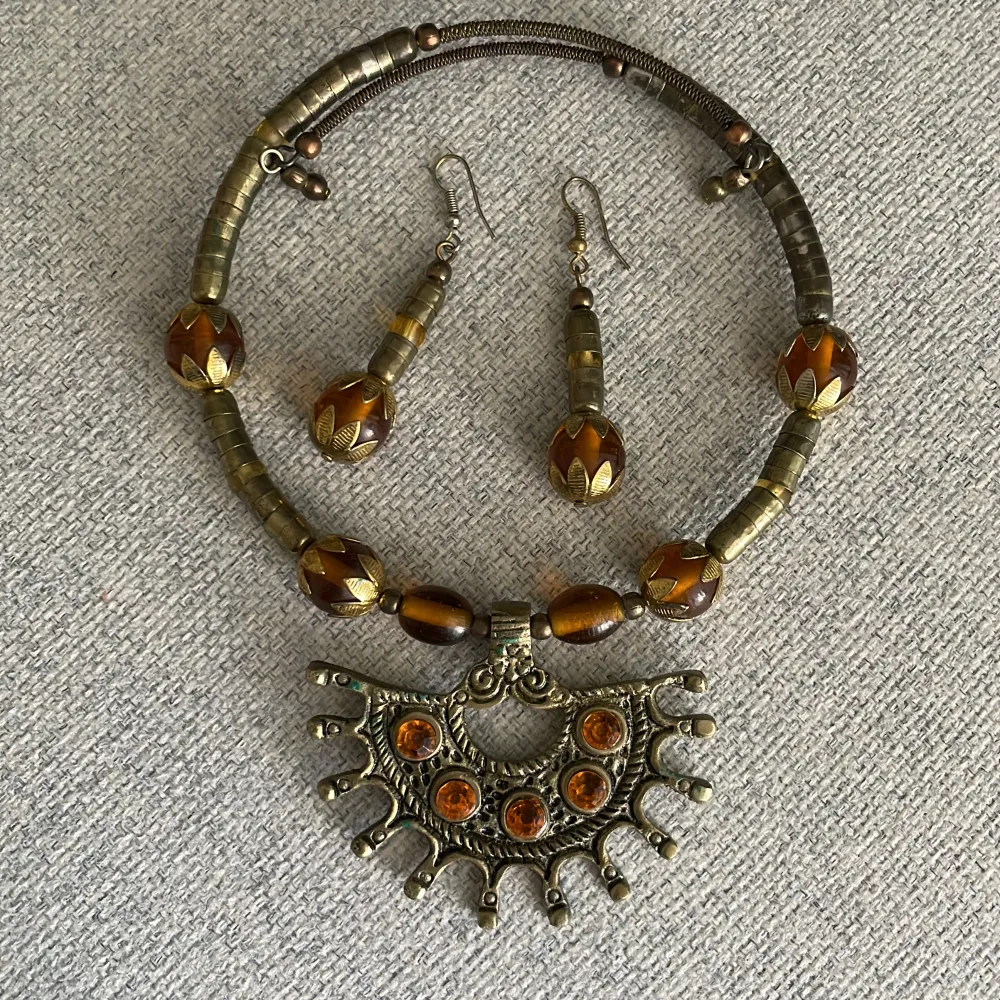 It’s made of brass Necklace  Earrings  . Accessoarer.