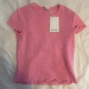 Fin rosa tröja med detaljer 