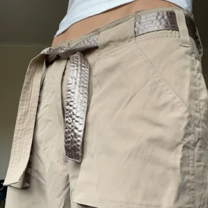Dream Cargo Khakis with Satin Detail - They are perfect  Size S/M Long cargo pants many pockets satin lining  Ugh I don’t want to sell them  Vintage Lindex from Y2K era Tie belt 