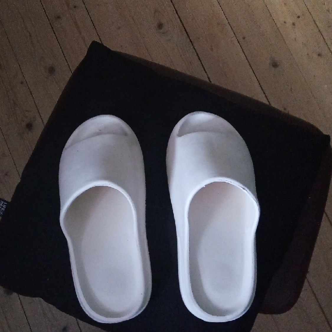 Adidas yeezy slides.  - 91