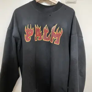 Palm Angels flame logo sweatshirt with  distressing throughout the sweatshirt in a faded black / washed black colour. The size is Large. Sweatshirt is in perfect condition. No damage or flaws. Price can be lowered a little for a quick deal.
