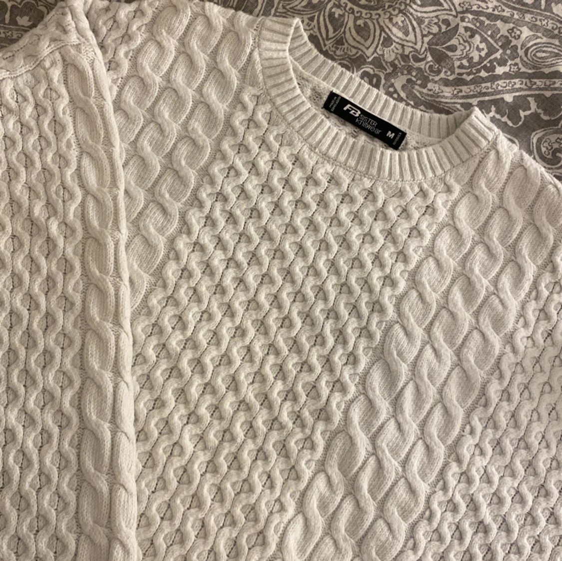 Flät stickad tröja