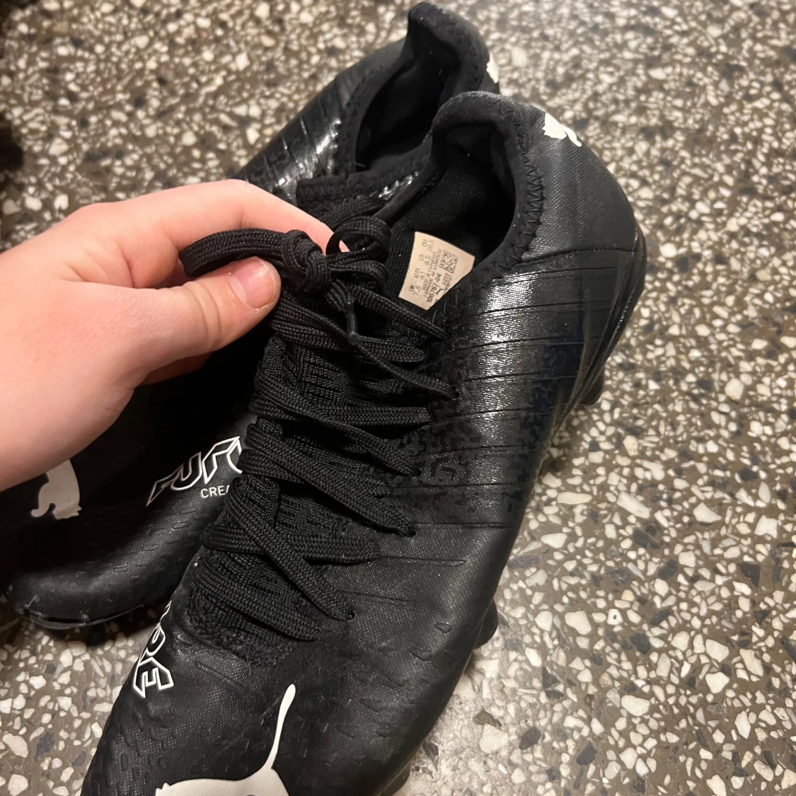 Svarta fotbollsskor från Puma - 91