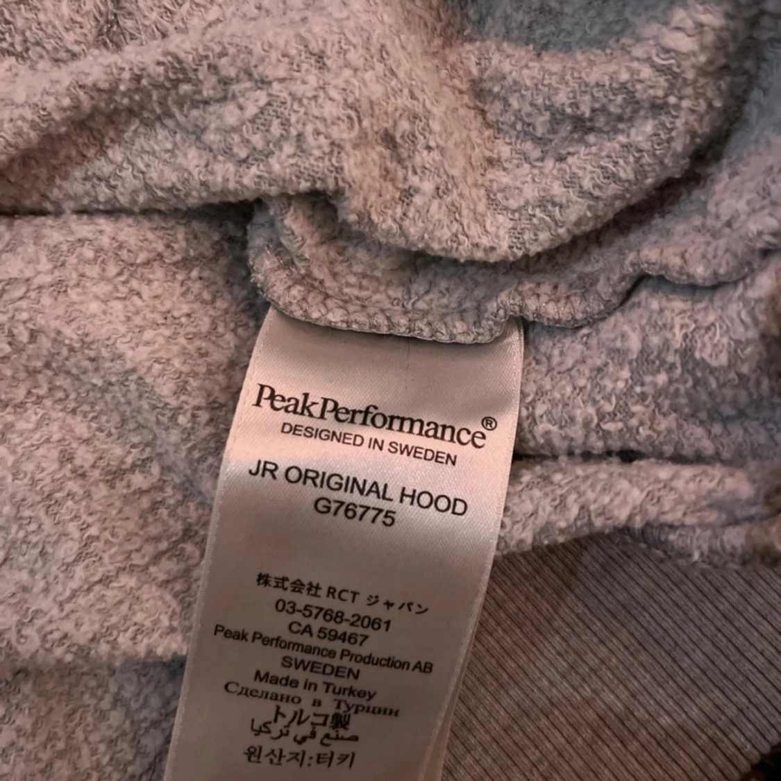 Grå hoodie från Peak Performance - 93