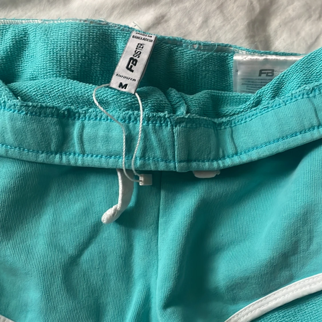 Ljus blå korta shorts - 91