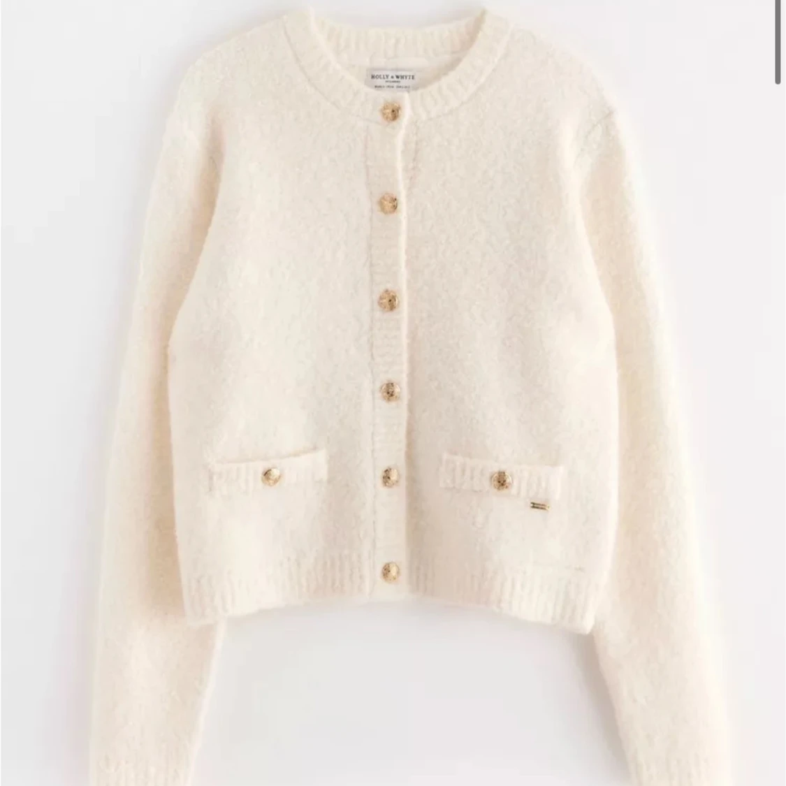 Kofta med guldknappar