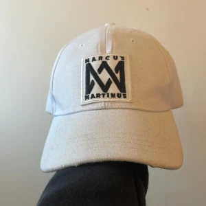 Marcus och martinus keps - Marcus och martinus keps i bra skick. Aldrig använd