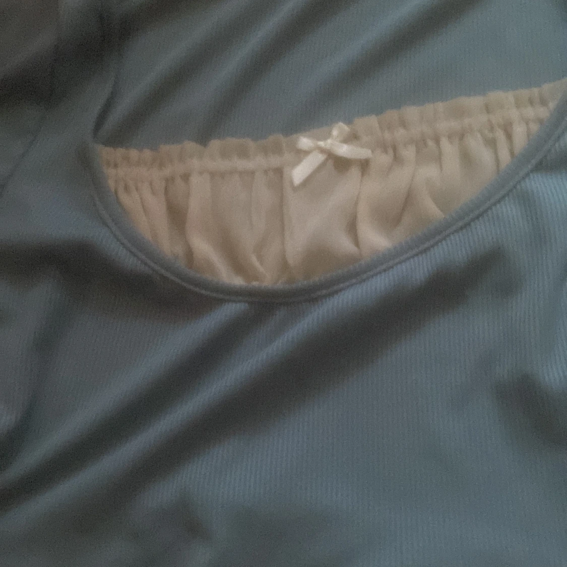 Blå långärmad topp med rosett - 90