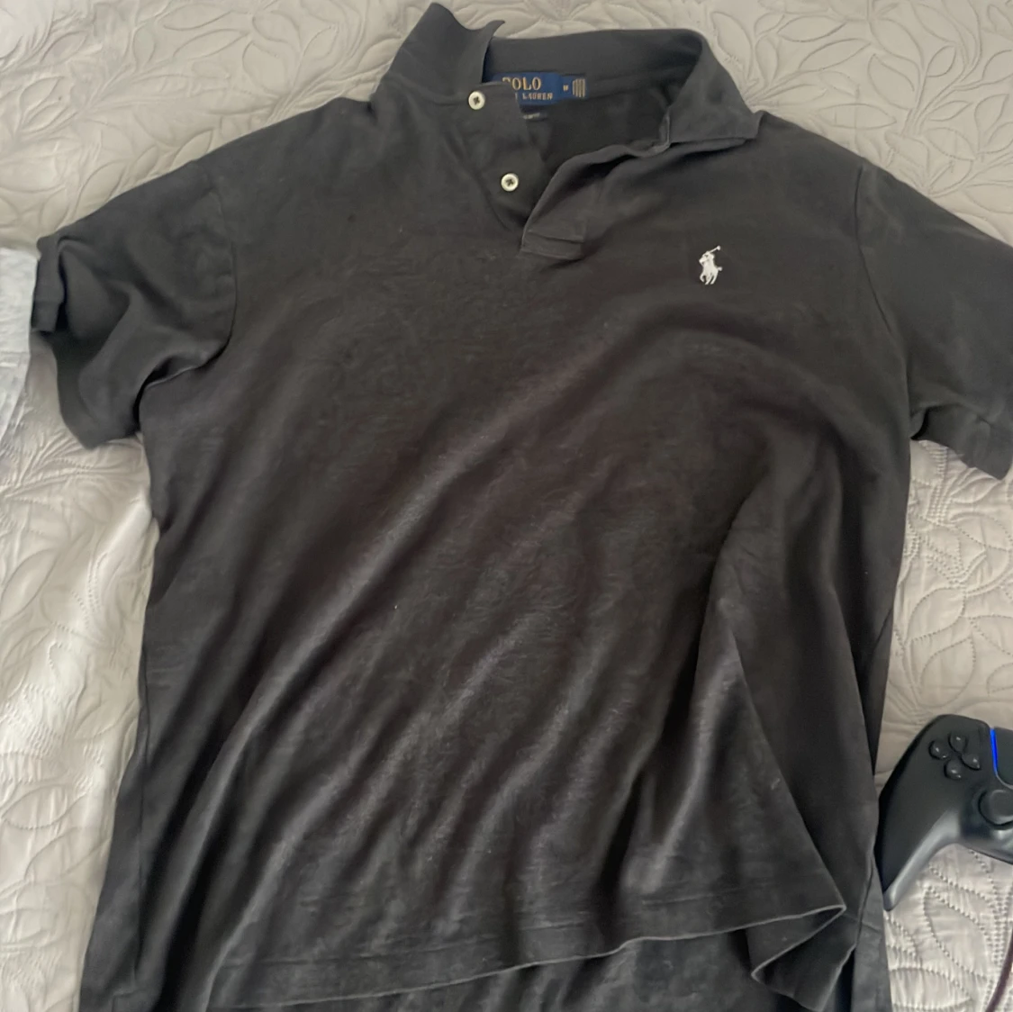 Svart ralph Lauren pike med vit loga 