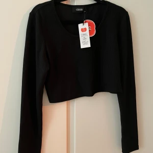 Svårt långärmad T-shirt  - Kroppad 