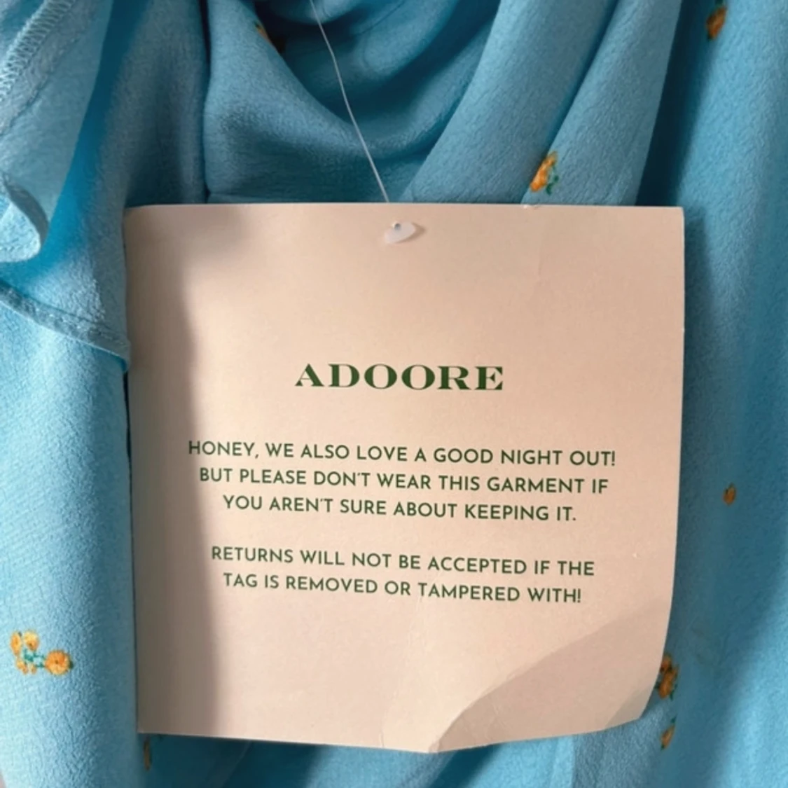 Adooreklänning med prislapp kvar - 91