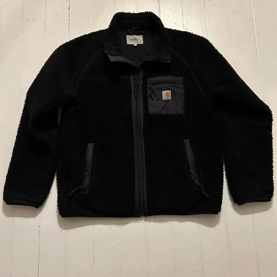 Svart fleecejacka från Carhartt