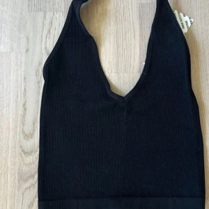 Urban outfitters halter neck - Black halter neck from Urban Outfitters  Size S New with tags 