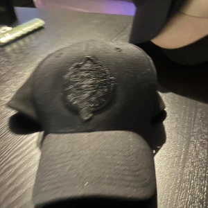 Björklöven Keps - En svart oanvänd Björklöven keps. 