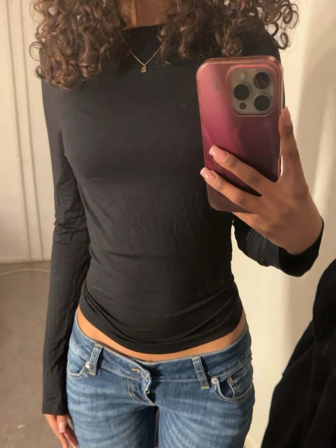 Svart långärmad topp med öppen rygg