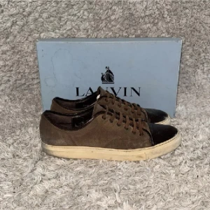 Lanvin skor - | Condition: 6/10 | Color: Brown, White and black | What is included: Box and sneakers | Retail price: 5 200kr |