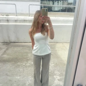 Badeutopp - Fin topp i glansigt satin/silkesmaterial. Från Zara