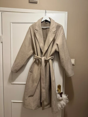 Beige kappa  - Använt fåtal gånger, fint skick 