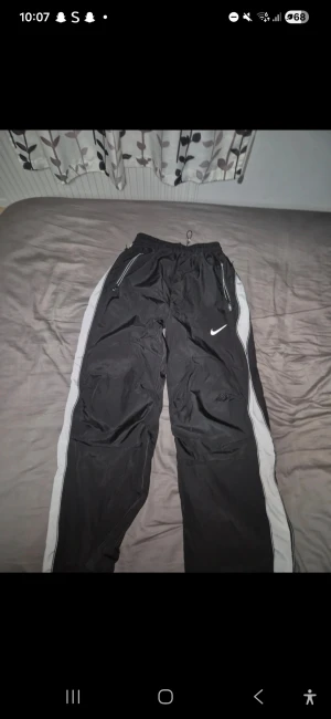 Nike track pants  - Nike track pants Perfect for streetwear and gym Comfortable, you can make the pants baggier with the zipper