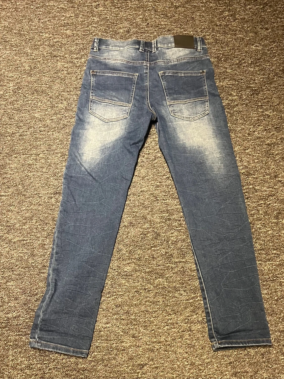 Blå jeansbyxor  - 1