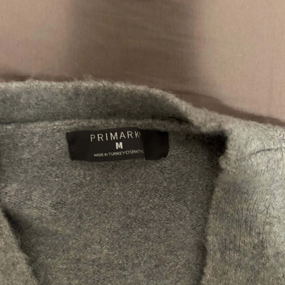 Grå kofta med rosettknäppning Primark - 3