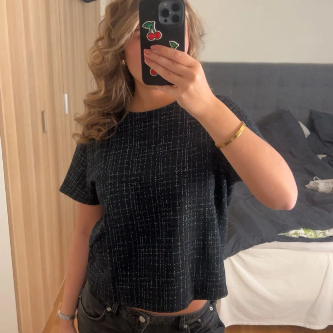 Svart rutig topp med kort ärm