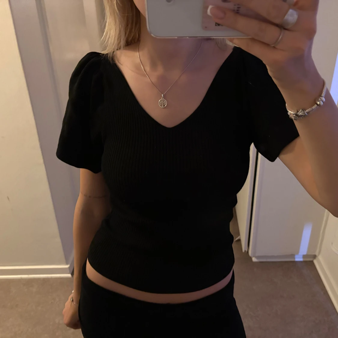 Topp med knyte i ryggen