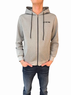 Grå zip-hoodie från CCM - Grå hoodie med dragkedja från CCM. Klassisk modell med huva och svarta snören, samt fickor framtill. CCM-logga tryckt på bröstet och i större format på ryggen. Perfekt för dig som gillar sportig och clean stil.