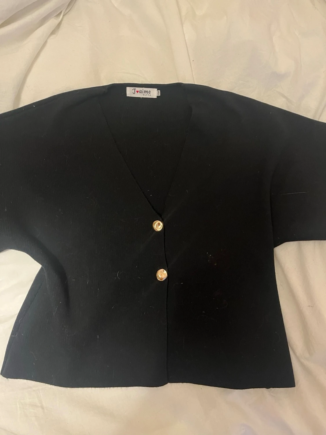 Svart blus med guldknappar  - 1