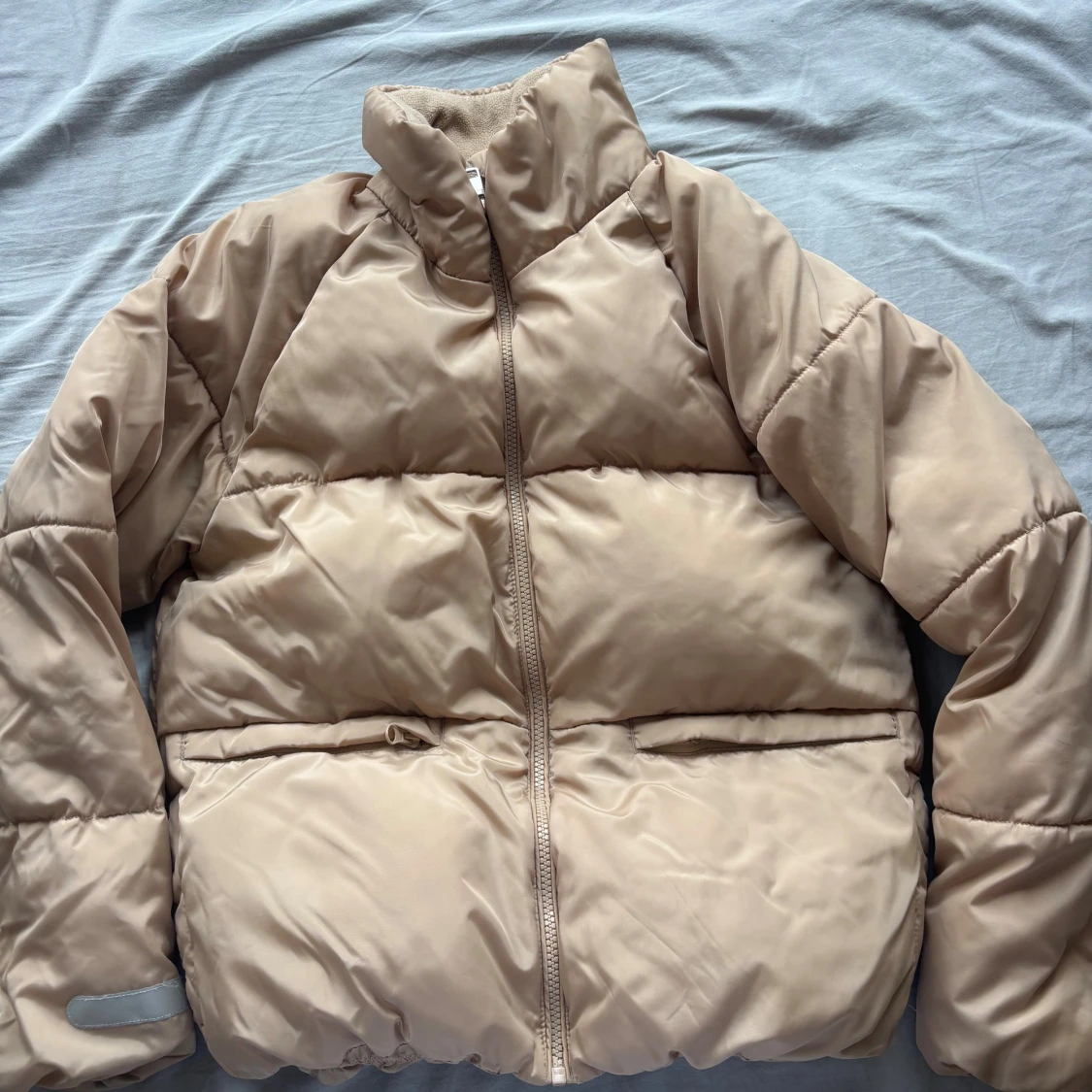 Beige pufferjacka från Lindex