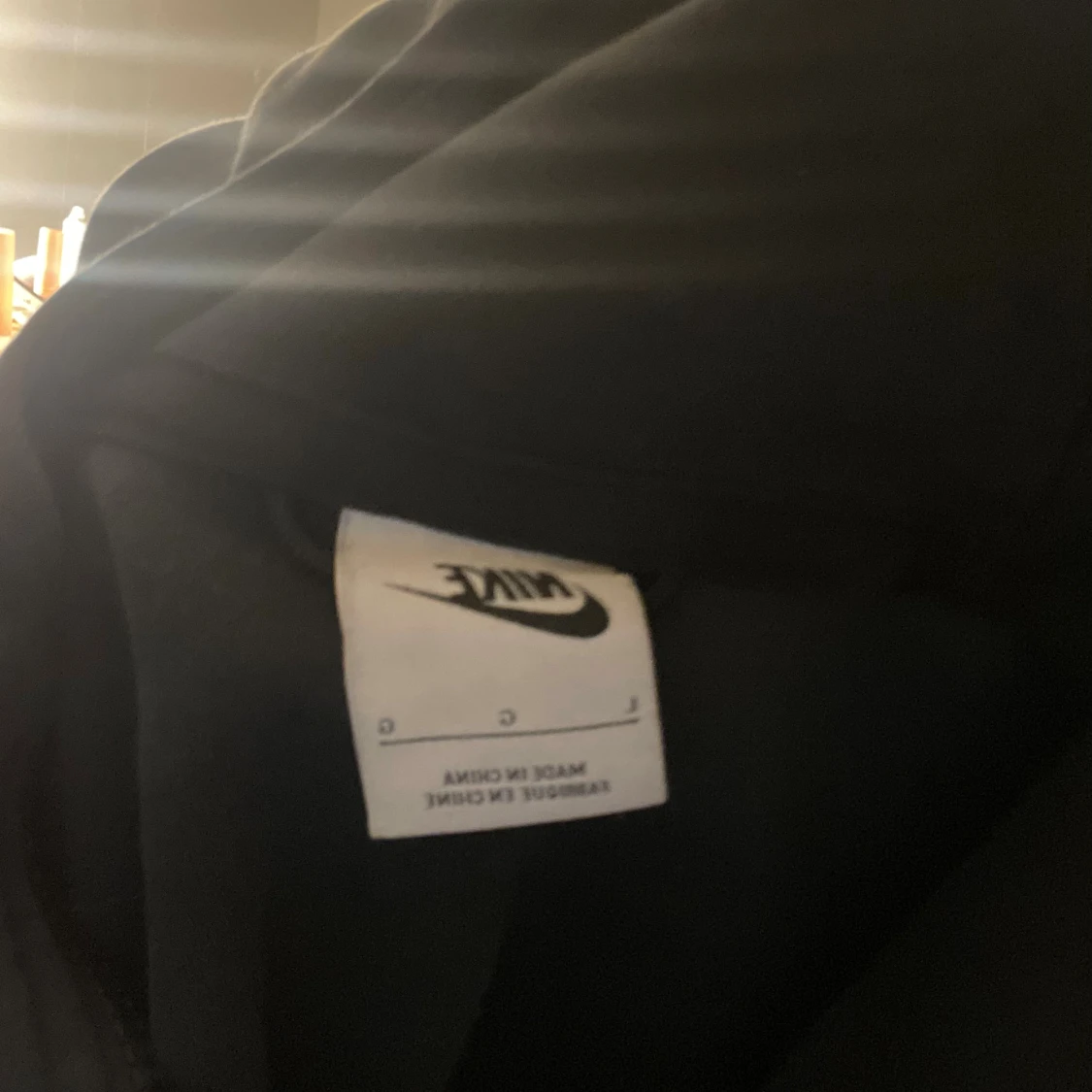 Svart hoodie från Nike med dragkedja - 1