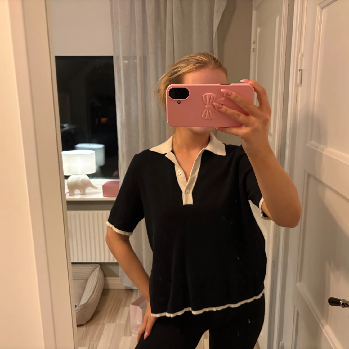 Svart pikétröja från Lexington