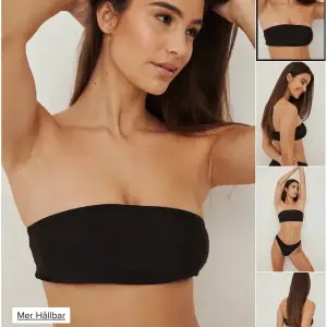 Svart bandeau överdel från NA-KD. Använd flera gånger men fortfarande bra skick och form. Ordinariepris 129kr och nypris 70kr.