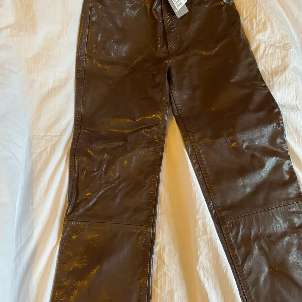 Shiny  leather , new, too little new price 2499kr. Jeans & Byxor.