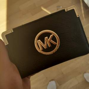 En plånbok i gott skick från MK