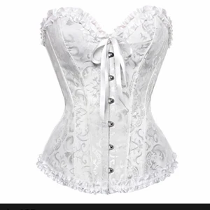 Korsett - En vit fin korsett som bara är använd en gång! Väldigt snygg