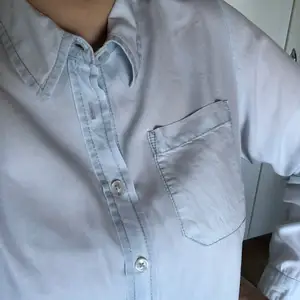 Size small (plus size) light blue shirt, used only once. 