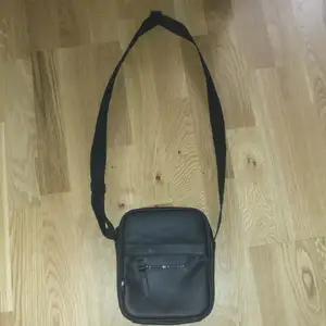 Crossbody bag designer. Made out of leather and bearly used.