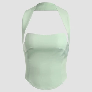 Sage green halter top - Dö snygg halter top i ”silkes” material. Korsettliknande top med ett band som går runt nacken. Jätte snygg på, säljer på grund av fel storlek. 