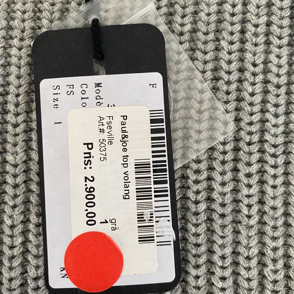 Grå stickad väst med volang  - 91