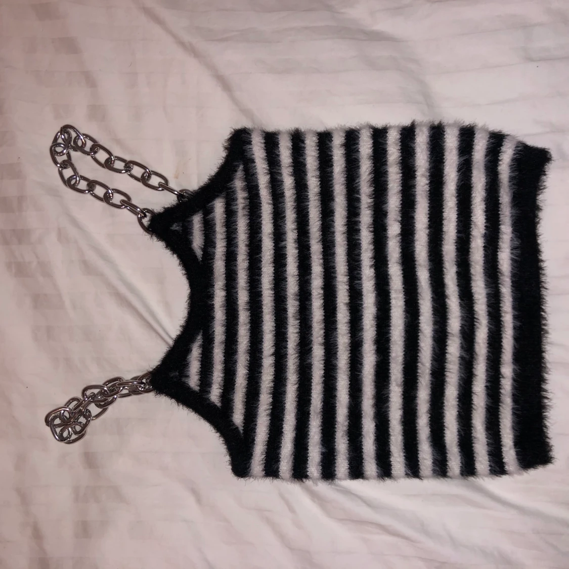 The Ragged Priest topp med kedja