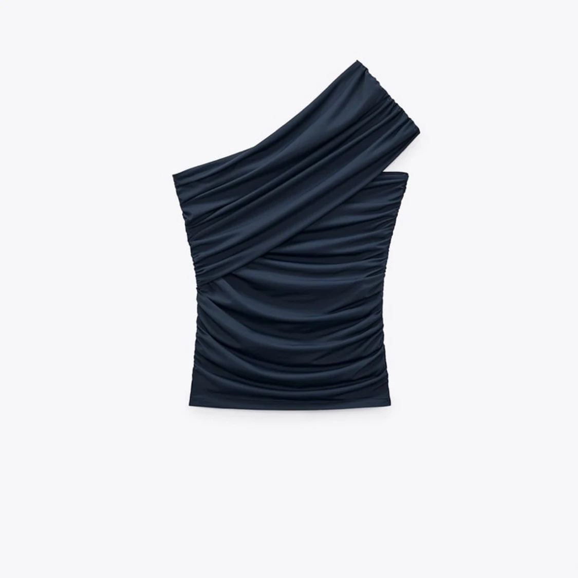 Asymmetrisk topp med veck