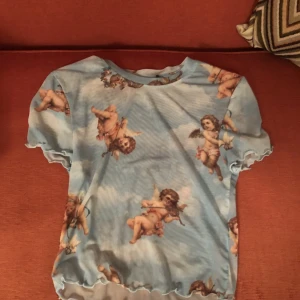 Mesh ängel t-shirt - Mesh tyg t-shirt. Troligtvis S, men den är väldigt stretchig!