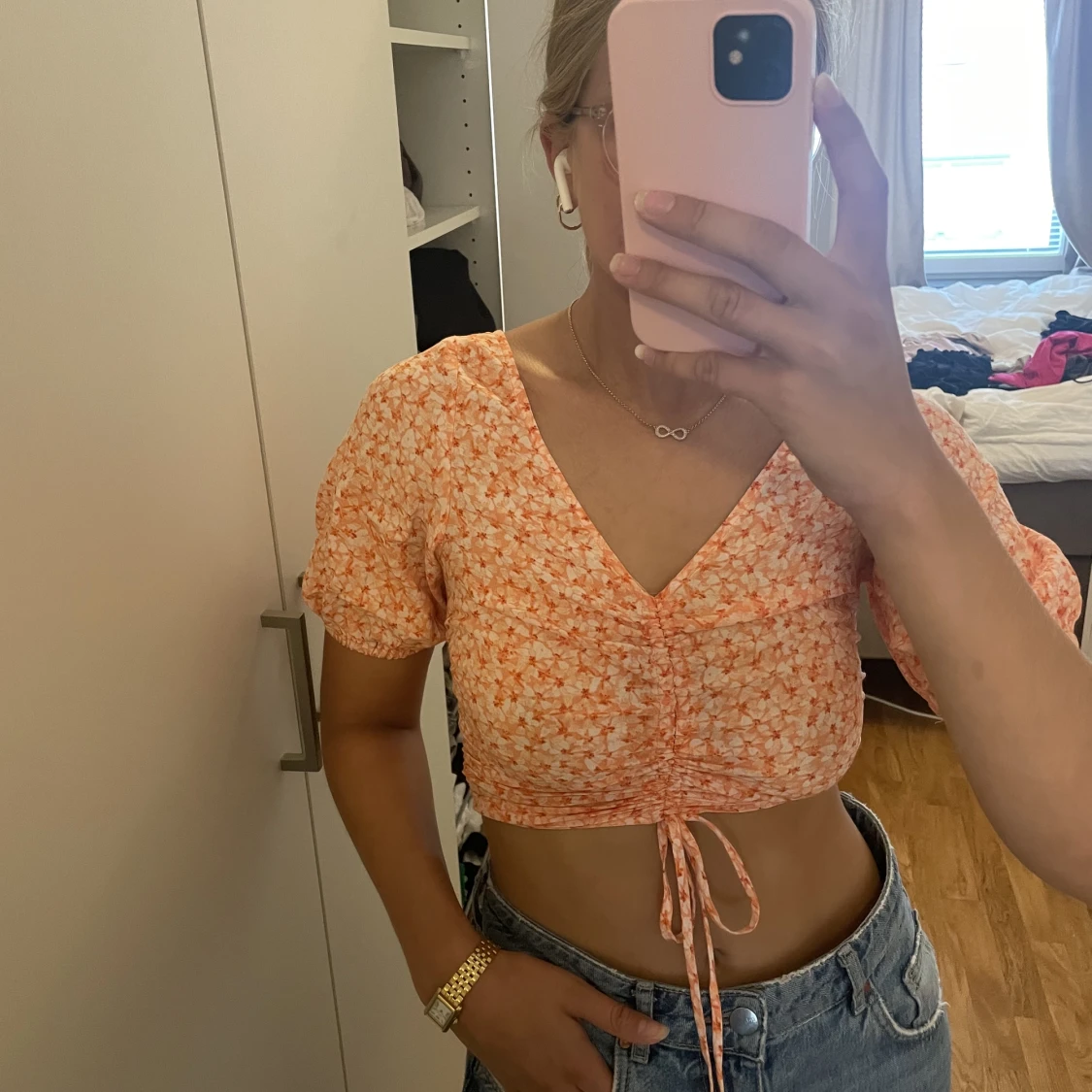 Orange blommig sommartopp.