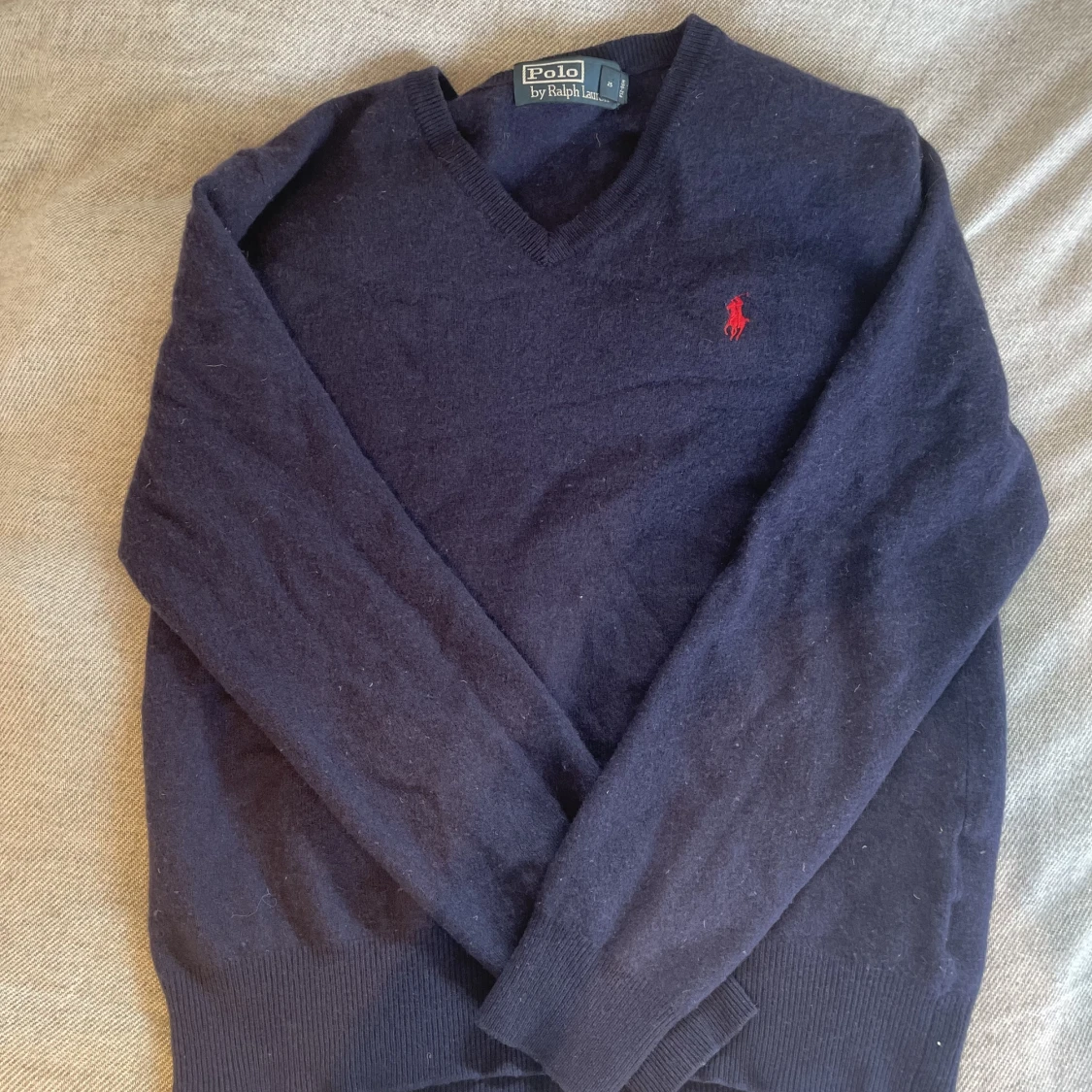 Marinblå stickad tröja från Raulph Lauren